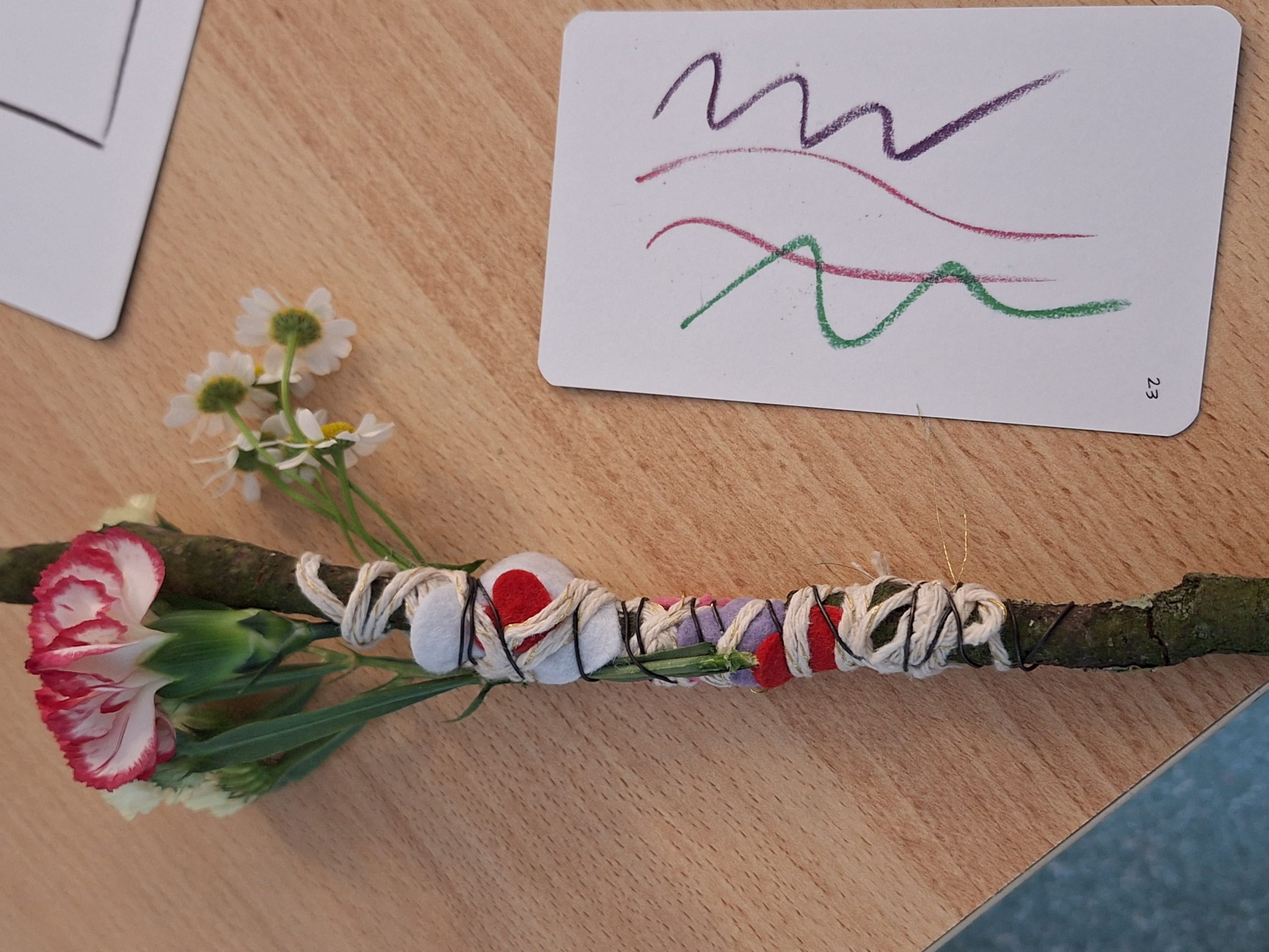 Work combining natural materials inspired by the scribble on the card